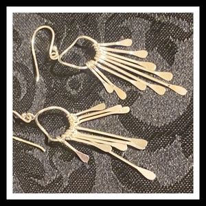 Silver toned art dangle bangle earrings
